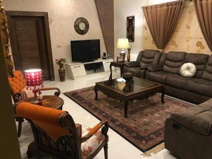 MJS Entire New Designer House 5 BR 13 bed 2 living reclining sofas Italian kitchen 6 bath garage side garden at prime location of Bahria Town Islamabad - image 11