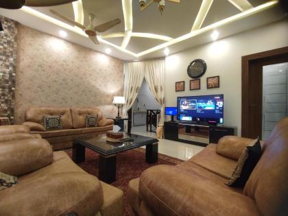 MJS Entire New Designer House 5 BR 13 bed 2 living reclining sofas Italian kitchen 6 bath garage side garden at prime location of Bahria Town Islamabad - image 19